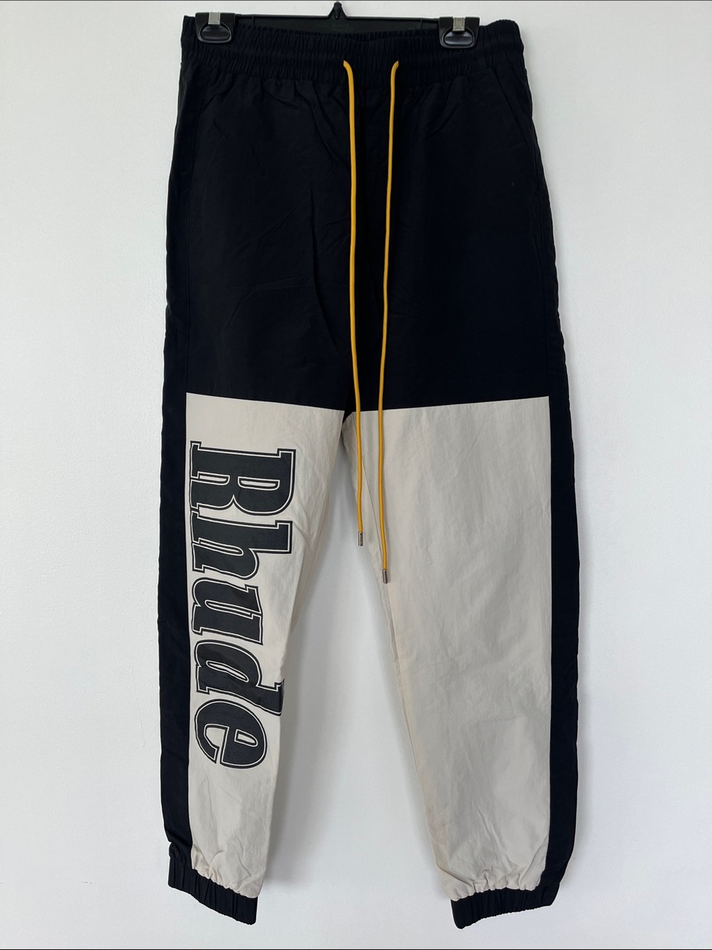 Rhude Black & Cream Colorblock Joggers with Yellow Drawcord